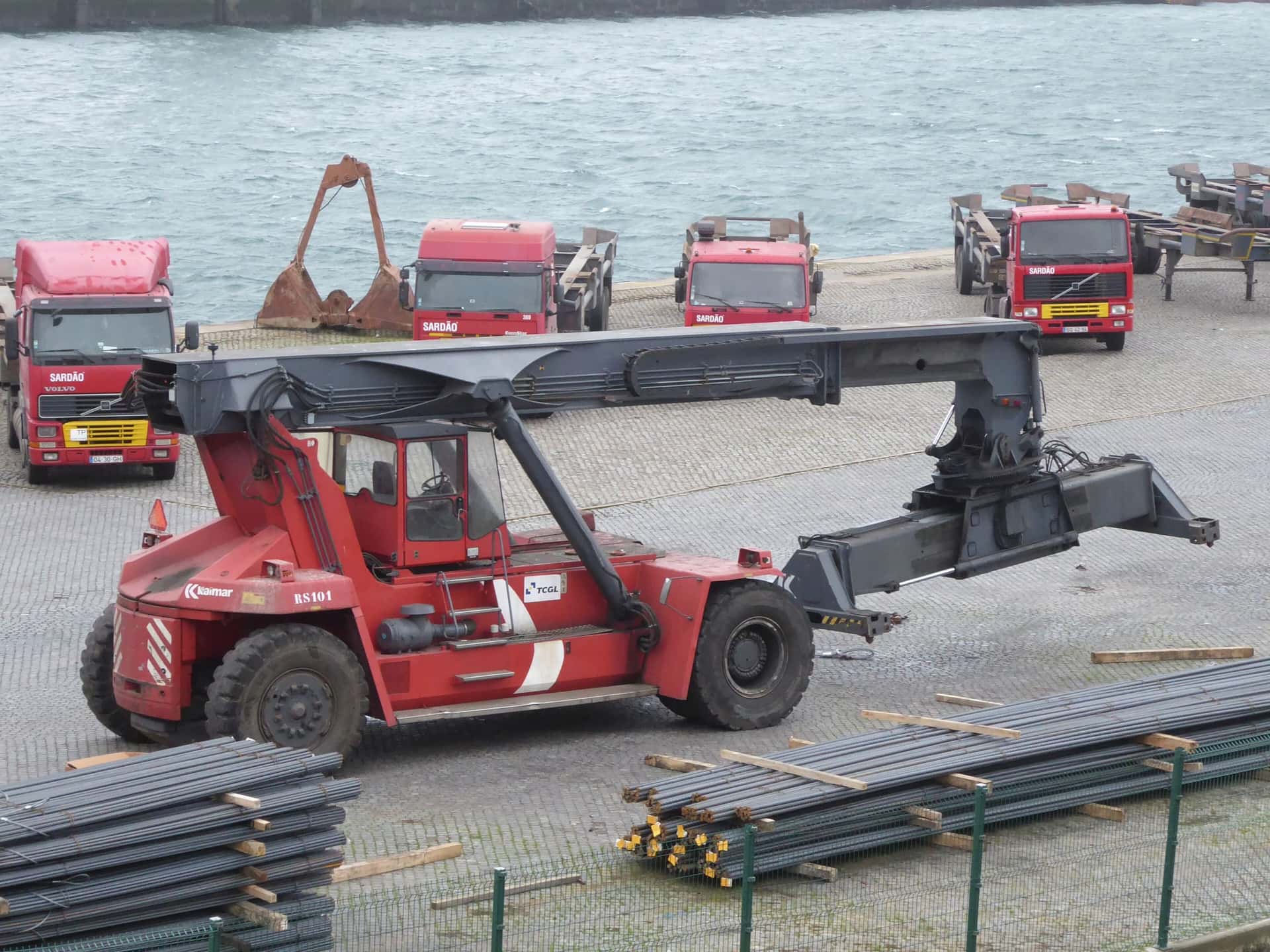 A reach stacker lifting a container in a depot yard