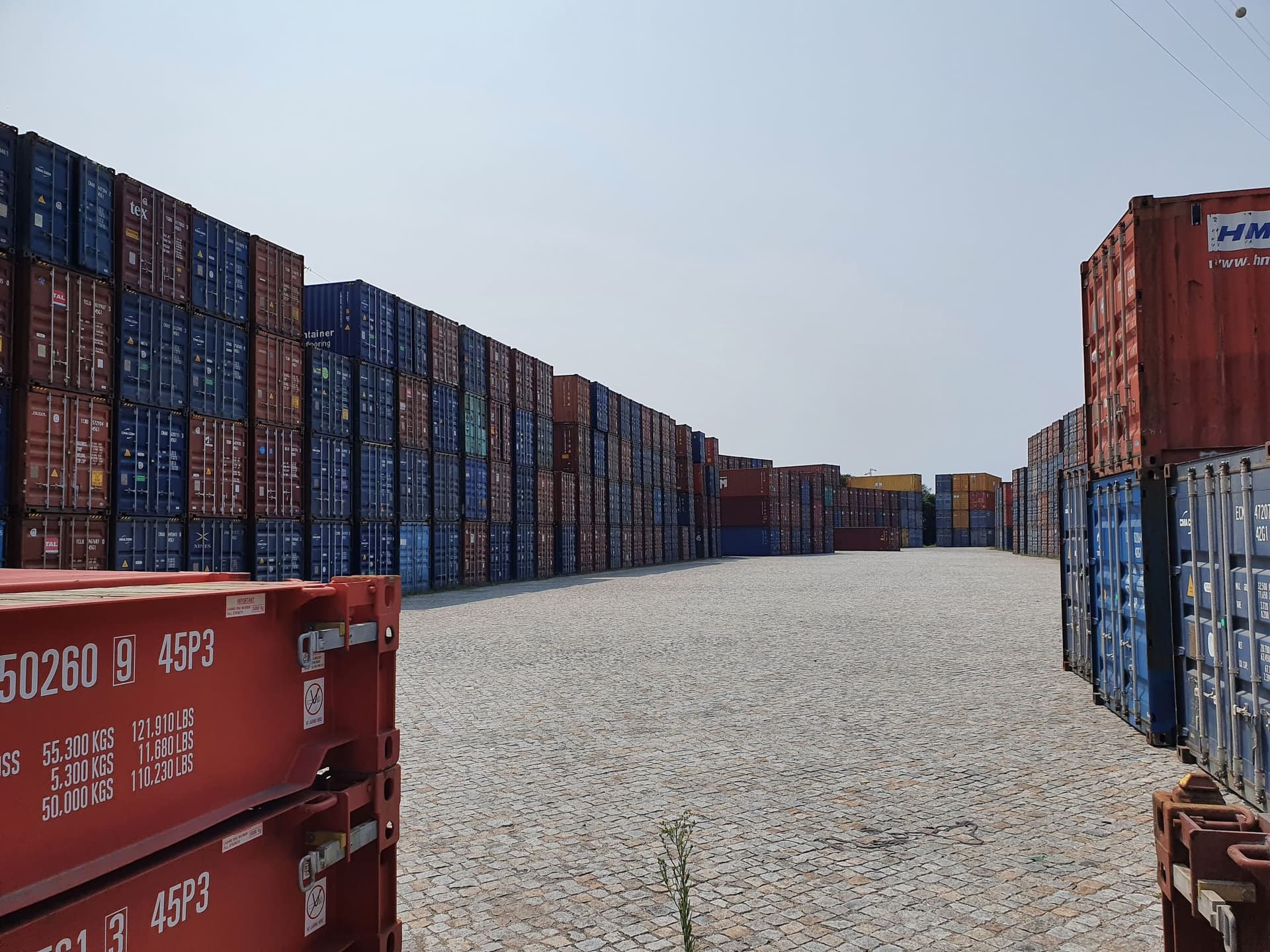 Empty containers stacked in a container depot