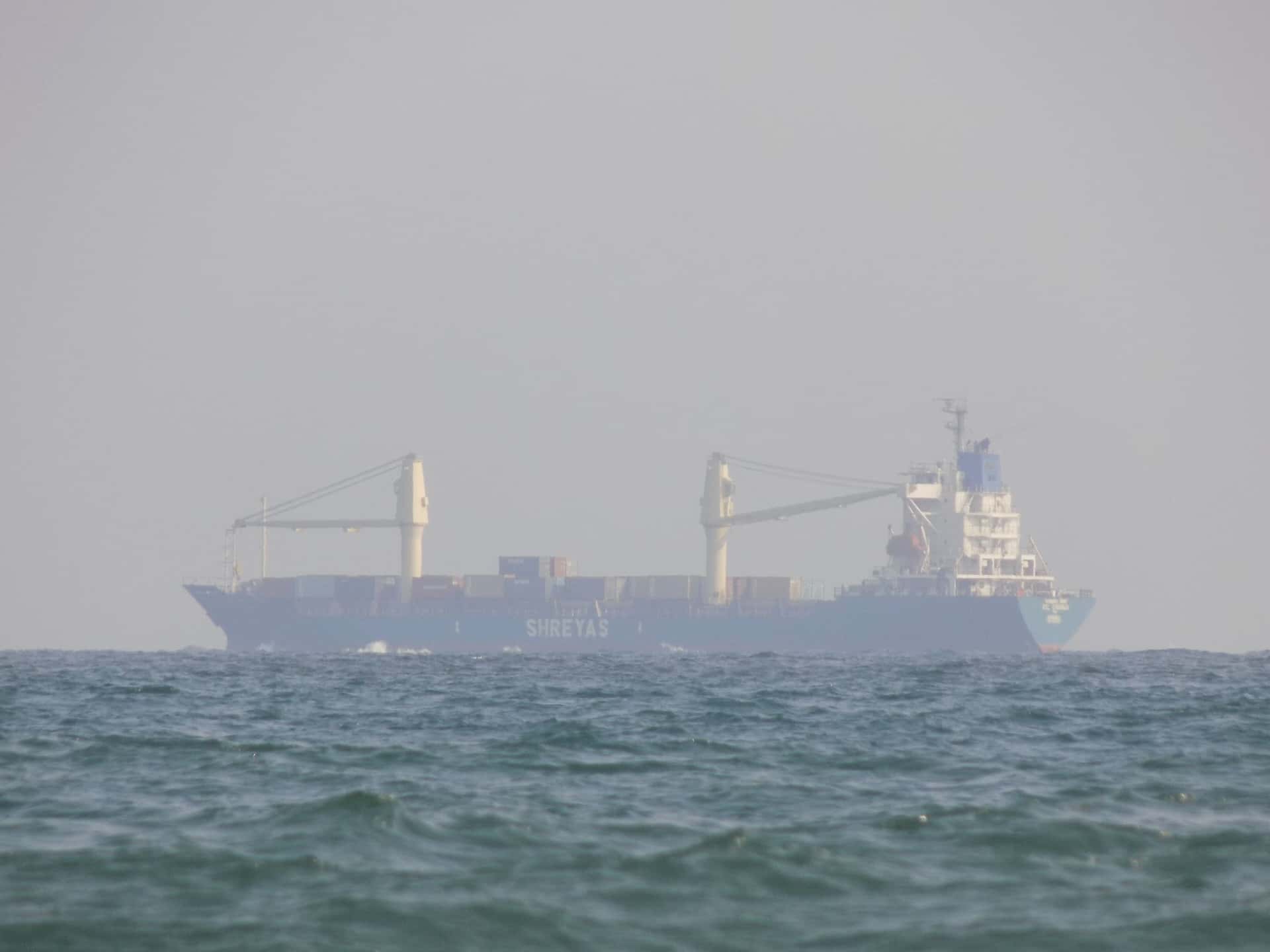 A loaded container ship under way, the leg that returns equipment to the Asian export gateways